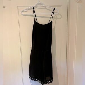 Black romper with crossbody back